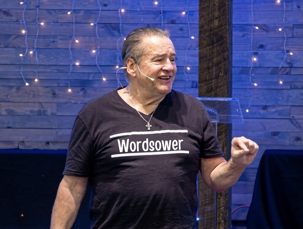 Ken Bortz on stage passionately presenting the Word of God